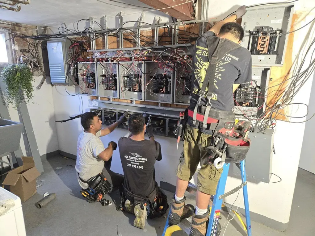 AGE Electric crew completing a residential electrical service upgrade